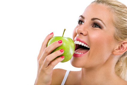 11female biting apple smiling
