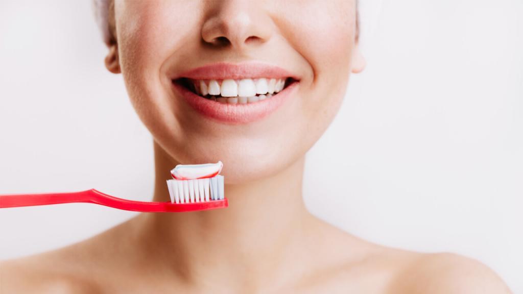 woman with a smiling face and a toothbrush